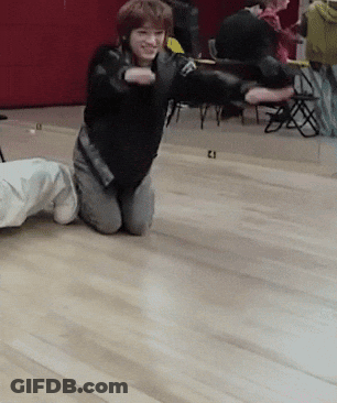 Person Kneeling With Number 21 GIF