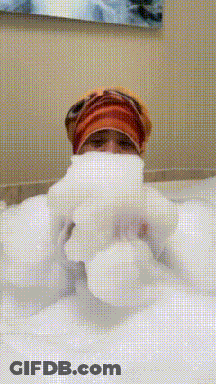 Person Laying In Bathtub With Foam Coming Out Of Mouth GIF