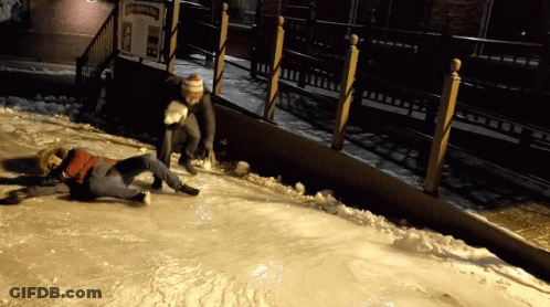 Person Laying In Front Of Ice Skating Sign GIF