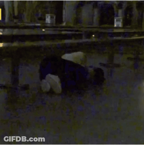 Person Laying In Front Of Yellow A Sign GIF