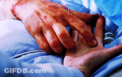 Person Laying In Hospital Bed Holding Hands GIF