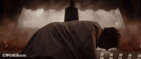 Person Laying On Back In Dark Room With Silhouette GIF