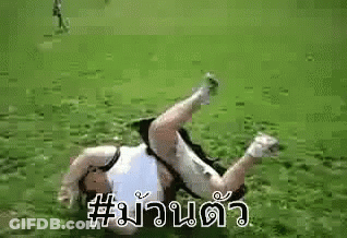 Person Laying On Back In Grass On Soccer Field GIF