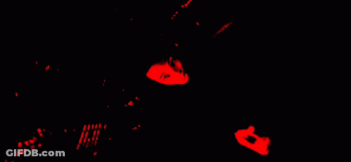 Person Laying On Back With Red Background And Black Shirt Saying Evil GIF