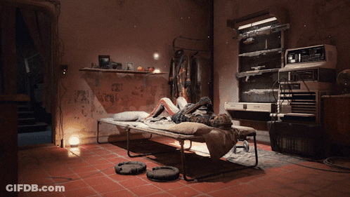 Person Laying On Bed In Room With Graffiti Wall GIF