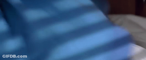Person Laying On Bed With Blue Background GIF
