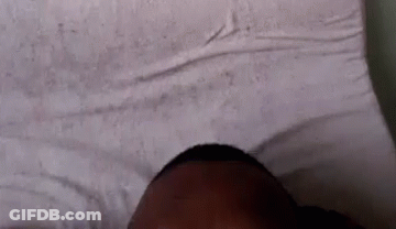 Person Laying On Bed With Eyes Closed GIF