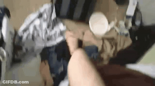 Person Laying On Bed With Legs Crossed And Coffee GIF