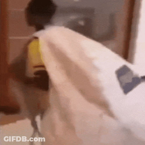 Person Laying On Bed With White Blanket GIF