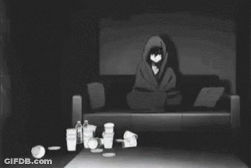 Person Laying On Couch In Dark Room With Trash GIF