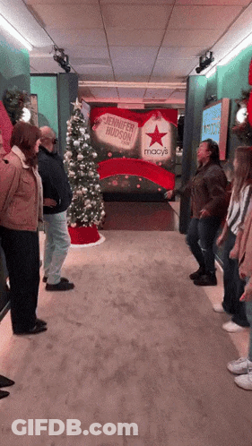 Person Laying On Floor In Front Of Red Cross GIF