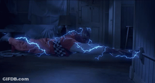 Person Laying On Floor With Lightning From Hands GIF