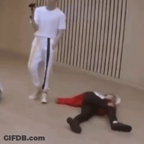 Person Laying On Floor With Man Holding Microphone GIF