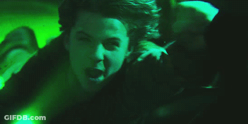 Person Laying On Ground With Green Light GIF