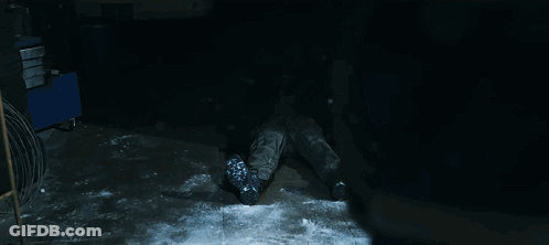 Person Laying On Ground With Gun On Knee GIF