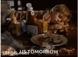 Person Laying On Table With Plate Of Food GIF