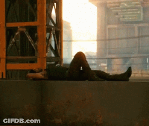 Person Laying On Wall With Feet Crossed GIF