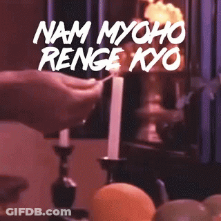 Person Lighting Candle With Text Nam Myoho Renge Kyo GIF