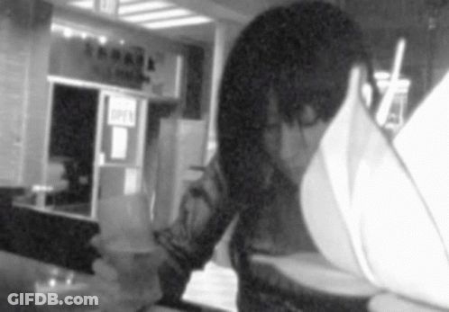 Person Looking At Menu In Front Of Open Sign GIF