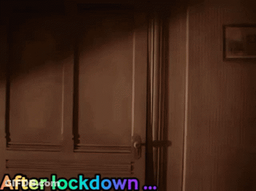 Person Looking Out Window After Lock Down GIF