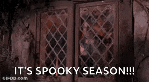 Person Looking Out Window It's Spooky Season GIF