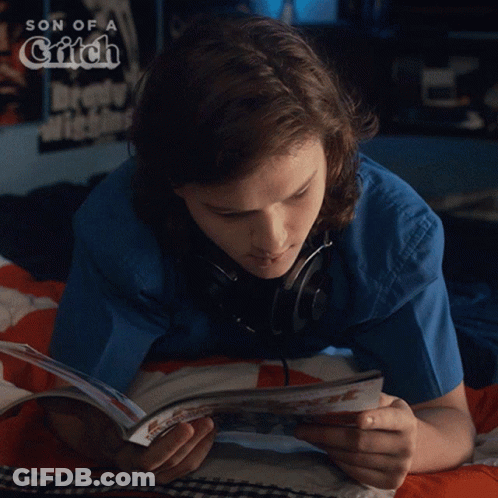 Person Lying In Bed Reading Son Of A Grifch GIF