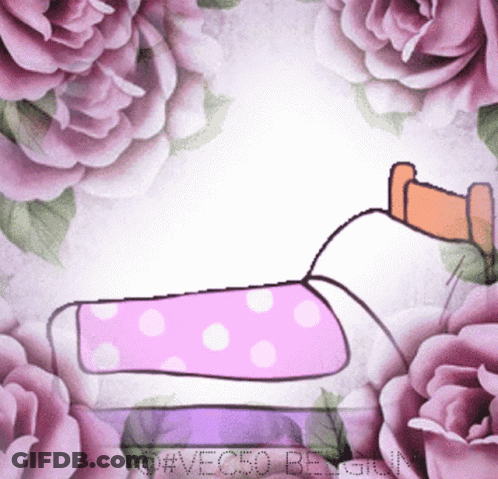 Person Lying On Bed Surrounded By Roses GIF