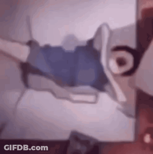 Person Lying On Bed With Crossed Legs GIF