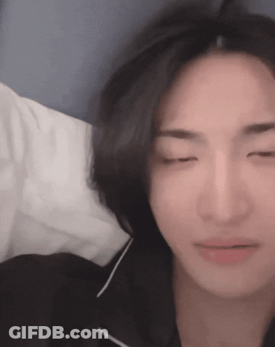 Person Lying On Bed With Eyes Closed GIF