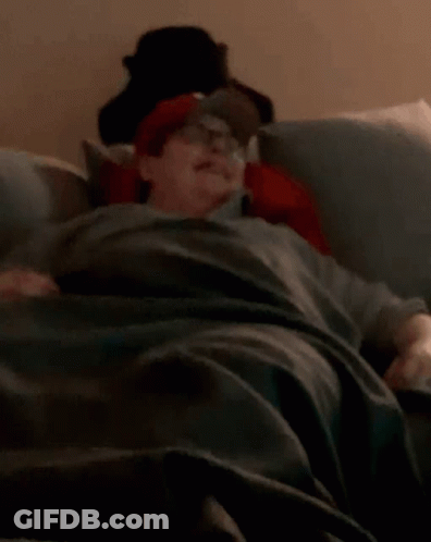Person Lying On Bed With Hat GIF