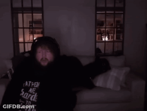 Person Lying On Couch In Dark Room GIF