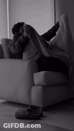 Person Lying On Couch With Feet Up GIF