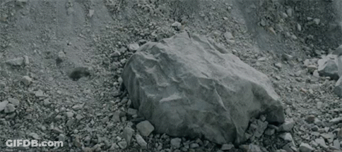 Person Lying On Ground With Blanket On Head GIF