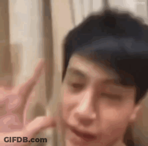 Person Making Peace Sign GIF