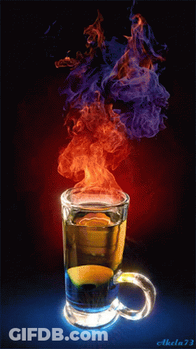 Person Mixing Drink With Spoon In Glass GIF