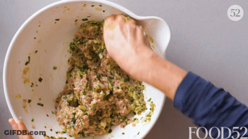Person Mixing Food In Bowl With Number 52 GIF