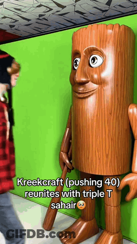Person Next To Tree Trunk Statue GIF