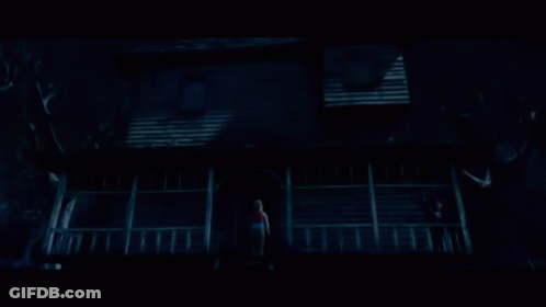 Person On Haunted House Porch GIF