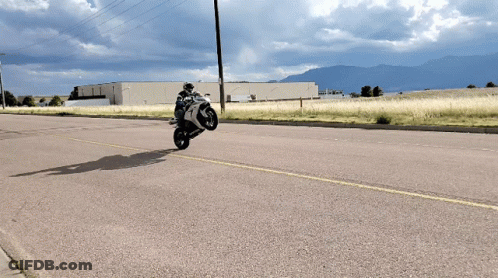 Person On Kawasaki Motorcycle Doing Trick GIF