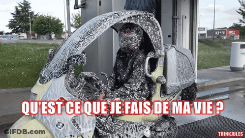 Person On Motorcycle With Qu'est Ce Que Je Fais De Ma Vie GIF