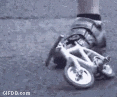 Person On Roller Skates Riding Bicycle GIF