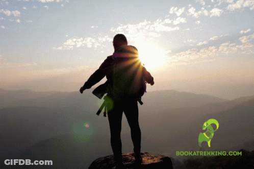 Person On Top Of Mountain With Bookatrekking.com Logo GIF