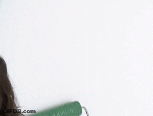 Person Painting Green Wall With Roller GIF