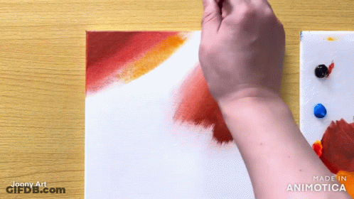 Person Painting With Red And Yellow Paint GIF