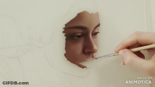 Person Painting Woman's Face With Brush GIF