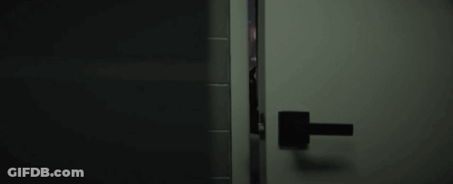 Person Peeking Through Door GIF