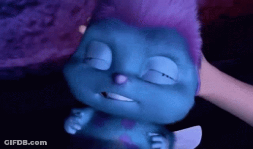 Person Petting Blue Cartoon Character With Purple Hair GIF