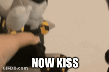 Person Petting Stuffed Animal Saying Now Kiss GIF