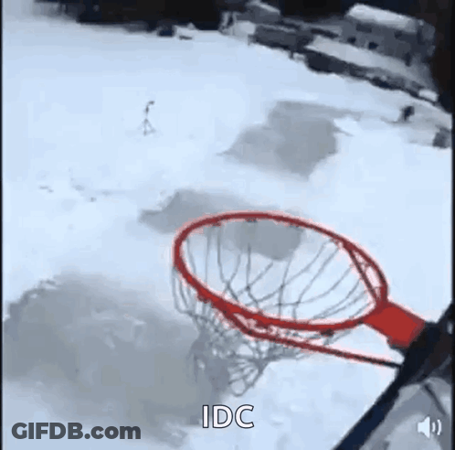 Person Playing Basketball In Snow Through Net GIF