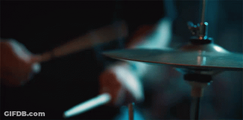 Person Playing Cymbal With Drum Stick GIF